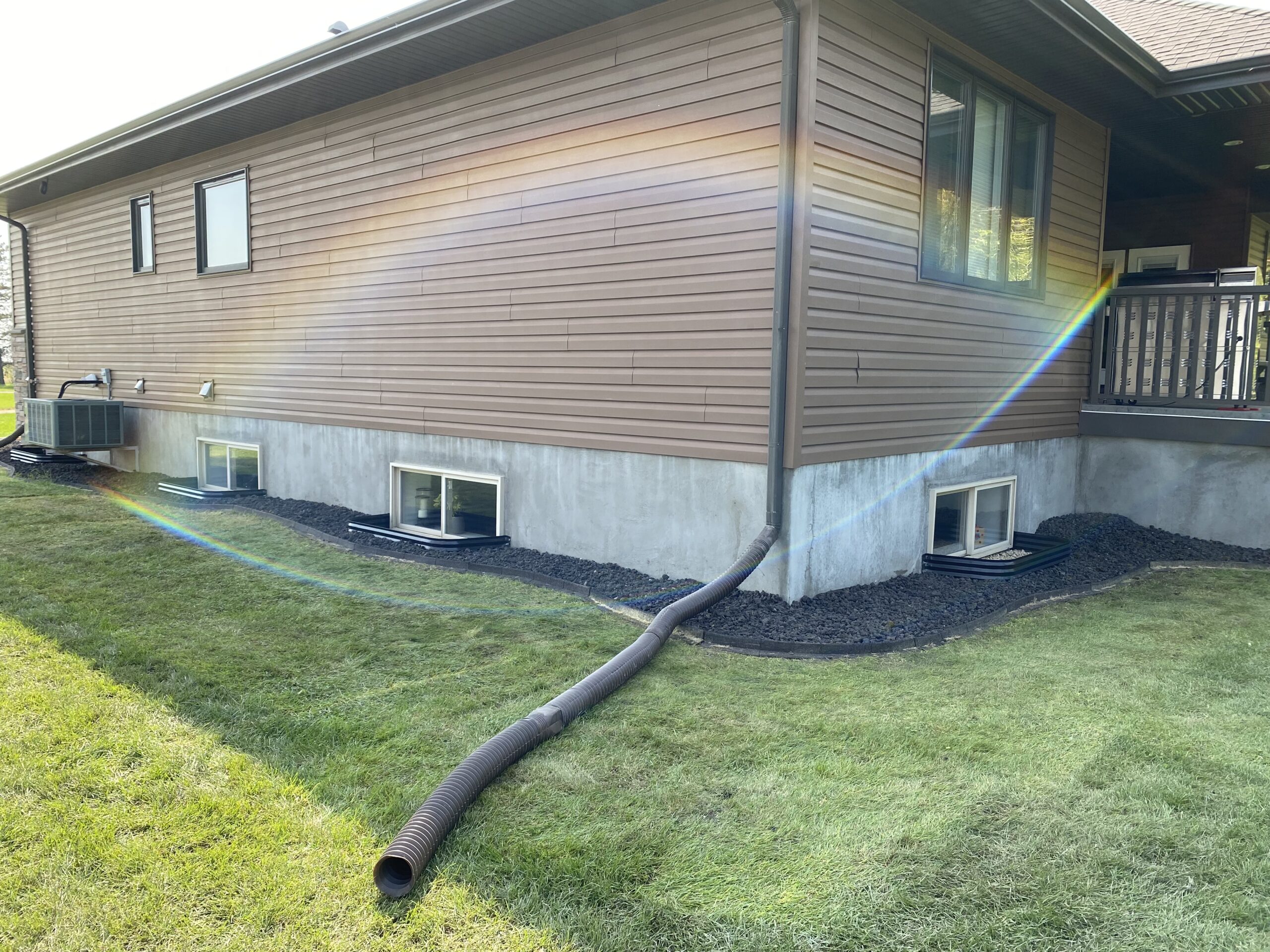 St. Albert Foundation Repair - residential home exterior showing graded yard